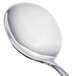 A close-up of a Walco stainless steel bouillon spoon with a silver handle.