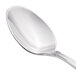 A Walco Luxor stainless steel dessert spoon with a silver handle.