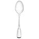 A Walco stainless steel teaspoon with a long handle.