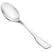 A Walco Luxor stainless steel teaspoon with a long silver handle.