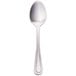 A Walco Pacific Rim stainless steel demitasse spoon with a silver handle.