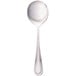 A silver Walco Pacific Rim bouillon spoon with a white background.