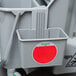 A grey Unger side bucket with a red sticker.