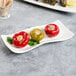 A Villeroy & Boch white porcelain rectangular plate with a skewer and three red bell peppers.