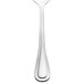 A close-up of a Walco stainless steel dessert spoon with a white background.