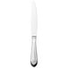 A silver Walco Meteor stainless steel table knife with a white handle.