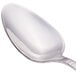 A Walco Meteor stainless steel teaspoon with a silver handle.