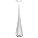A Walco stainless steel salad fork with a white handle.