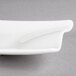 A white rectangular Villeroy & Boch porcelain plate on a gray surface.