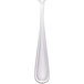 A Walco stainless steel dessert spoon with a white handle.