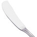 A Walco stainless steel butter spreader with a white handle.