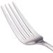 A close-up of a Walco Meteor stainless steel dinner fork with a silver handle.
