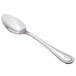 A Walco stainless steel dessert spoon with a silver handle and spoon.