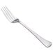 A close-up of a silver Walco Bosa Nova table fork.
