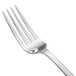 A close-up of a Walco Bosa Nova stainless steel table fork with a silver handle.