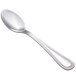 A silver spoon with a decorative handle.