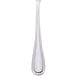A Walco stainless steel table fork with a white handle.