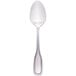 A Walco stainless steel teaspoon with a silver handle and round top on a white background.