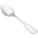 A close-up of a Walco stainless steel teaspoon with a white handle.