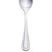 A Walco stainless steel demitasse spoon with a white handle.