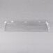 A clear plastic tray liner with a handle on a white surface.