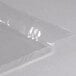 A clear plastic wrapper for American Metalcraft food display baskets.