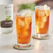 Two glasses of iced tea with lemon slices made with Monin Zero Calorie Natural Sweetener.