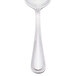 A Walco stainless steel bouillon spoon with a pointed handle.