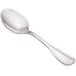 A close-up of a Walco Saville stainless steel demitasse spoon with a silver handle.