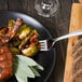 A plate of food with a Walco stainless steel dinner fork.