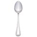 A Walco stainless steel tablespoon with a white handle.