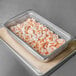 A Choice stainless steel steam table pan with shrimp in it.