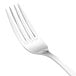A close-up of a Walco Lisbon stainless steel table fork with a silver handle.