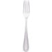 A close-up of a Walco stainless steel utility/salad fork with a silver handle.