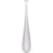 A close-up of a Walco stainless steel utility/salad fork with a white handle.