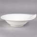 A white Villeroy & Boch porcelain bowl on a gray surface.