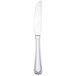 A silver Walco stainless steel European table knife with a black edge on a white background.