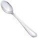 A close-up of a Walco stainless steel demitasse spoon with a silver handle.