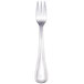 A silver Walco cocktail fork with a white handle.