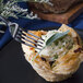 A Walco Marcie stainless steel dinner fork in a pastry.