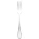 A close-up of a Walco stainless steel dinner fork with a white handle.