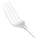 A close-up of a Walco stainless steel dinner fork with a white handle.
