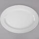 A white oval melamine platter with a white rim.