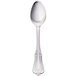 A Walco stainless steel teaspoon with a handle.