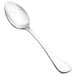 A close-up of a Walco stainless steel dessert spoon with a silver handle.