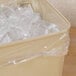 A white plastic bag with ice in it.
