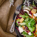 A salad with beets, carrots, and other vegetables served with a Walco Barony stainless steel salad fork.