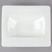 A white square plate with a curved edge.