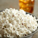 A bowl of Amish Country Red Butterfly popcorn kernels.