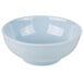 A light blue Thunder Group Blue Jade melamine bowl with a white rim.